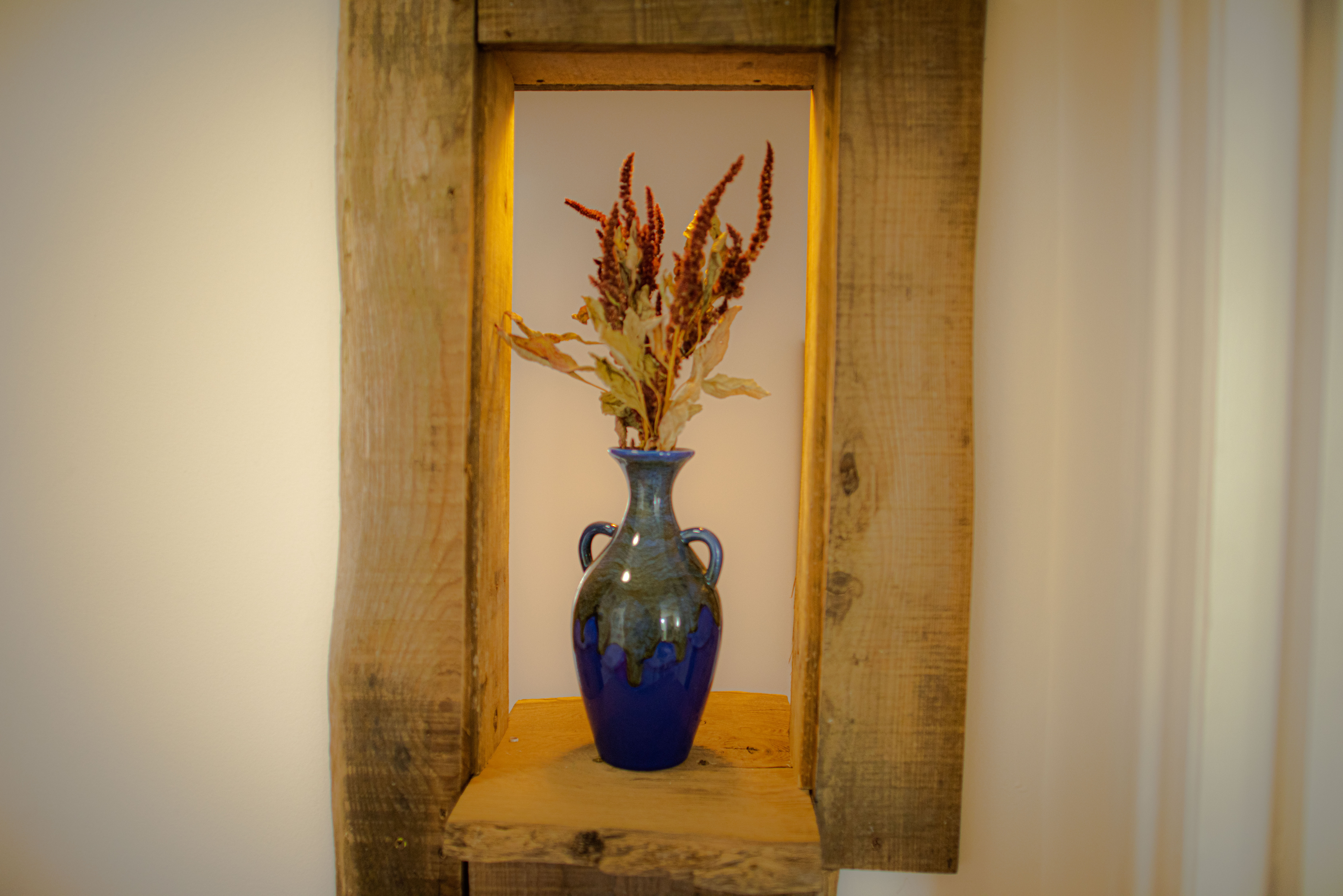 Blue vase and dried flowers
