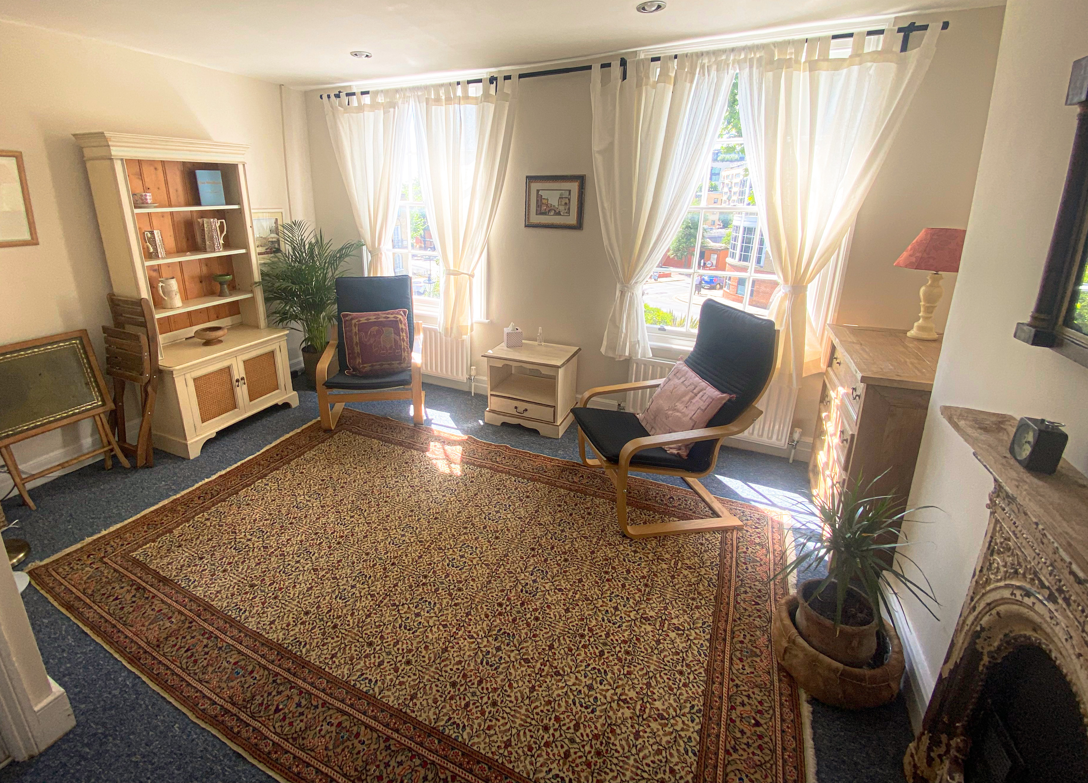 Spacious therapy room with two chairs in The Practice Rooms in Islington