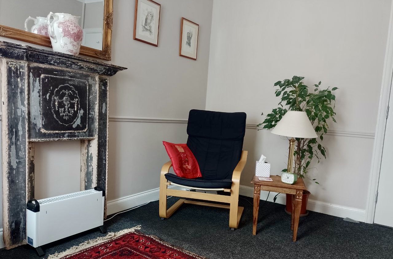 Therapy Room with chair and a fireplace at The Practice Rooms in Norwich