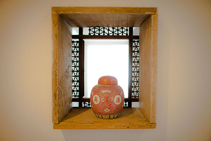 Orange decorative jar in a hollow alcove
