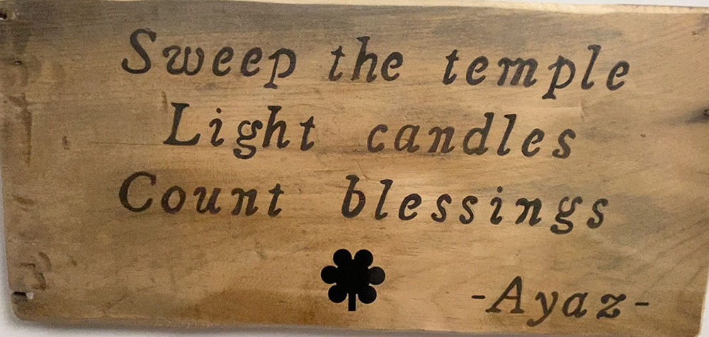 'Sweep the Temple, Light candles, Count Blessings' quote board